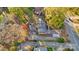 An aerial view of a residential home with mature trees and a driveway in a neighborhood setting at 841 12Th Nw Ave, Hickory, NC 28601