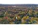 Aerial view of a home nestled among colorful fall foliage within a vibrant residential neighborhood at 841 12Th Nw Ave, Hickory, NC 28601