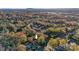 Aerial view of a home nestled among colorful fall foliage within a vibrant residential neighborhood at 841 12Th Nw Ave, Hickory, NC 28601