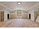 Spacious attic renovation in progress, with a window, and doorway visible at 841 12Th Nw Ave, Hickory, NC 28601