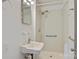 Bathroom featuring a stand-up shower, grab bar, and an updated sink at 841 12Th Nw Ave, Hickory, NC 28601