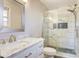 Renovated bathroom features marble tile, glass shower, and modern vanity at 841 12Th Nw Ave, Hickory, NC 28601