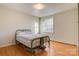 Cozy bedroom featuring hardwood floors and a window with natural light at 841 12Th Nw Ave, Hickory, NC 28601