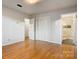 A comfortable bedroom with hardwood floors features closet space and bathroom access at 841 12Th Nw Ave, Hickory, NC 28601