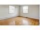 Bright bedroom features hardwood floors and large windows, offering ample natural light at 841 12Th Nw Ave, Hickory, NC 28601