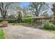 View of a carport and backyard with a wooden storage shed at 841 12Th Nw Ave, Hickory, NC 28601
