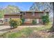Attractive exterior featuring brick and wood accents with mature landscaping and a well-maintained lawn at 841 12Th Nw Ave, Hickory, NC 28601