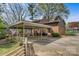 Backyard view featuring a large carport and brick home exterior at 841 12Th Nw Ave, Hickory, NC 28601
