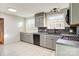 Functional kitchen featuring gray cabinets, a gas range, and ample counter space at 841 12Th Nw Ave, Hickory, NC 28601