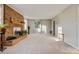 Bright living room with a brick fireplace, large windows, and neutral carpet and paint at 841 12Th Nw Ave, Hickory, NC 28601