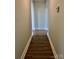 Hallway with hardwood floors and white trim, leading to other rooms at 120 W Edinburgh Ct, Statesville, NC 28625