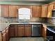 Kitchen featuring granite countertops, stainless steel appliances, and tile backsplash at 120 W Edinburgh Ct, Statesville, NC 28625