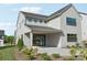 Back exterior view of house featuring patio and sliding glass door at 15008 Brownleigh Ln # 29, Huntersville, NC 28078