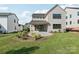 Wide angle shot of a home's backyard showing a manicured lawn and patio at 15008 Brownleigh Ln # 29, Huntersville, NC 28078