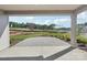 View of a landscaped backyard from a covered patio featuring a stone paver patio at 15008 Brownleigh Ln # 29, Huntersville, NC 28078