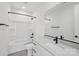 Clean bathroom featuring modern fixtures, white tiling, and natural light at 15008 Brownleigh Ln # 29, Huntersville, NC 28078