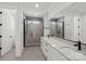 Modern bathroom featuring a double vanity, glass shower, and sleek fixtures at 15008 Brownleigh Ln # 29, Huntersville, NC 28078