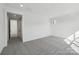 Bright bedroom boasts an ensuite bathroom with a barn door entrance and modern design at 15008 Brownleigh Ln # 29, Huntersville, NC 28078