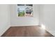 Bright bedroom with large windows and hardwood floors at 15008 Brownleigh Ln # 29, Huntersville, NC 28078