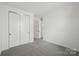 Bright bedroom with large closet space and neutral carpeting to complement any design style at 15008 Brownleigh Ln # 29, Huntersville, NC 28078