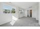 Bright bedroom with plush carpeting and ample natural light at 15008 Brownleigh Ln # 29, Huntersville, NC 28078