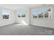 Bright bedroom featuring carpeting, natural light, and trim at 15008 Brownleigh Ln # 29, Huntersville, NC 28078