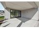 Covered patio area featuring concrete and stone pavers with sliding glass door access at 15008 Brownleigh Ln # 29, Huntersville, NC 28078