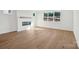 Bright living room with hardwood floors and modern fireplace at 15008 Brownleigh Ln # 29, Huntersville, NC 28078