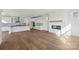 Open-concept living room with modern fireplace and hardwood flooring at 15008 Brownleigh Ln # 29, Huntersville, NC 28078