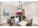 Formal dining room with hardwood floors and a modern chandelier at 17712 Yarwill Ct, Charlotte, NC 28278