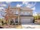 Two-story brick home with attached garage and landscaped front yard at 17712 Yarwill Ct, Charlotte, NC 28278