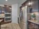 Kitchen with dark cabinets, granite countertops and stainless steel appliances at 1976 Copper Path Dr, Fort Mill, SC 29715