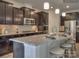 Kitchen with dark cabinets, granite countertops, and stainless steel appliances at 1976 Copper Path Dr, Fort Mill, SC 29715