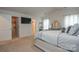 Bright, carpeted bedroom featuring an open closet and bathroom, ensuring a convenient and stylish living space at 318 Kingsford Dr, Stanley, NC 28164