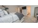 Serene bedroom featuring a bed, walk-in closet, and attached bathroom, offering convenience and style at 318 Kingsford Dr, Stanley, NC 28164