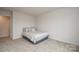 This cozy bedroom features neutral carpet and walls, with a queen sized bed at 318 Kingsford Dr, Stanley, NC 28164