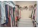 Organized walk-in closet with clothing racks and shelving, offering ample storage and easy access to apparel at 318 Kingsford Dr, Stanley, NC 28164
