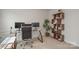 Functional office space featuring a desk setup, shelving, and natural light for a comfortable working environment at 318 Kingsford Dr, Stanley, NC 28164