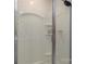 Bathroom shower with glass door and built-in shelving for toiletries, providing convenience and easy maintenance at 318 Kingsford Dr, Stanley, NC 28164