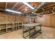Basement with exposed beams and a workbench at 4501 Taylorsville Hwy, Statesville, NC 28625