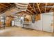 Unfinished basement with a utility sink and wooden wall paneling at 4501 Taylorsville Hwy, Statesville, NC 28625
