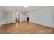 Spacious bedroom featuring hardwood floors, neutral walls, and a large closet for ample storage at 4501 Taylorsville Hwy, Statesville, NC 28625