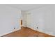 Bedroom featuring hardwood floors, neutral walls, closet, and natural light at 4501 Taylorsville Hwy, Statesville, NC 28625