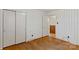 Bedroom with wood floors, neutral walls, and a closet providing storage space at 4501 Taylorsville Hwy, Statesville, NC 28625
