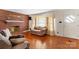 Inviting living room with hardwood floors, brick fireplace, and comfortable seating area near window at 4501 Taylorsville Hwy, Statesville, NC 28625