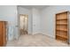 Neutral bedroom featuring a doorway to additional rooms and a wooden bookshelf at 654 Saddlebred Ln, Locust, NC 28097