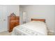 This bedroom features a bed with floral comforter and neutral colored walls at 654 Saddlebred Ln, Locust, NC 28097