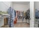 Walk-in closet with ample shelving for clothing and storage at 654 Saddlebred Ln, Locust, NC 28097