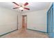 Bedroom with blue closet doors and a ceiling fan at 105 Kiser Ln, Statesville, NC 28677