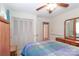 Bedroom with wood flooring, ceiling fan, and built-in closet at 105 Kiser Ln, Statesville, NC 28677